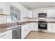Kitchen with stainless steel dishwasher and granite countertops at 807 Scrub Oak St, South Daytona, FL 32119