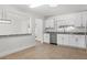 Kitchen with stainless steel dishwasher and granite countertops at 807 Scrub Oak St, South Daytona, FL 32119