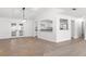 Spacious living room leading to the kitchen and a private sunroom through French doors at 807 Scrub Oak St, South Daytona, FL 32119