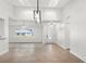 Open-concept living room featuring high ceilings and a stylish decorative ceiling light at 807 Scrub Oak St, South Daytona, FL 32119