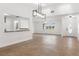 Bright living room boasts tile flooring, large window and modern light fixture at 807 Scrub Oak St, South Daytona, FL 32119
