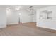 Bright living room with ceiling fan and view of the kitchen at 807 Scrub Oak St, South Daytona, FL 32119