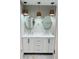 This bathroom features a dual sink vanity and pendant lighting at 992 Shockney Dr, Ormond Beach, FL 32174