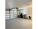 Spacious garage with ample storage and equipment, including water filtration system at 992 Shockney Dr, Ormond Beach, FL 32174
