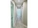 Hallway shows neutral gray walls, modern gray flooring, and updated lighting at 992 Shockney Dr, Ormond Beach, FL 32174