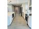 Modern kitchen featuring stainless steel appliances, a central island, and sleek white cabinetry at 992 Shockney Dr, Ormond Beach, FL 32174