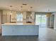 Open-concept kitchen with modern finishes and ample counter space for entertaining at 992 Shockney Dr, Ormond Beach, FL 32174