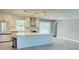 Modern kitchen with stainless steel appliances and a large center island at 992 Shockney Dr, Ormond Beach, FL 32174