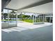 Screened patio overlooking a pool and a stunning waterfront view with lush landscaping at 992 Shockney Dr, Ormond Beach, FL 32174