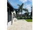 Outdoor patio with view of backyard, mature trees, and seating area at 992 Shockney Dr, Ormond Beach, FL 32174