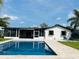 A refreshing backyard pool offers the perfect spot for relaxation and recreation with a screened-in patio at 992 Shockney Dr, Ormond Beach, FL 32174