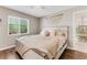 Bedroom with hardwood floors, large window, and a view to the entry door at 1719 Anniston Ave, Daytona Beach, FL 32117