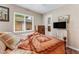 Cozy bedroom featuring a decorative bedspread, neutral tones, and natural light from a window at 1719 Anniston Ave, Daytona Beach, FL 32117