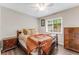 Bedroom with wood flooring and warm accents, creating a cozy and inviting retreat at 1719 Anniston Ave, Daytona Beach, FL 32117