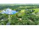 Aerial shot showcasing the home's proximity to a picturesque lake and abundant greenery at 2270 Wilmhurst Rd, Deland, FL 32720