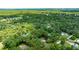 Aerial view of the parcel on a lot surrounded by mature trees with bordering red lines and nearby homes at 2270 Wilmhurst Rd, Deland, FL 32720