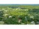 Elevated view of the home in a forested setting, boasting a private location with nearby residences and roads at 2270 Wilmhurst Rd, Deland, FL 32720