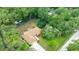 The aerial view displays the home's secluded backyard, surrounded by lush trees and expansive lawns at 2270 Wilmhurst Rd, Deland, FL 32720