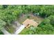 Aerial view of a home nestled among trees, showcasing the spacious backyard and extended driveway at 2270 Wilmhurst Rd, Deland, FL 32720