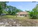 The home's backyard showcases a patio with sliding glass doors, ideal for indoor-outdoor living at 2270 Wilmhurst Rd, Deland, FL 32720