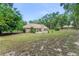 The home's backyard showcases a patio with sliding glass doors, ideal for indoor-outdoor living at 2270 Wilmhurst Rd, Deland, FL 32720