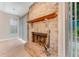 Traditional brick fireplace with wooden mantle, perfect for cozy evenings at 2270 Wilmhurst Rd, Deland, FL 32720