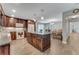 Spacious kitchen features wood cabinets, island, and open layout connecting to the dining area at 2270 Wilmhurst Rd, Deland, FL 32720