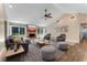 Spacious living room with vaulted ceilings, fireplace, comfortable seating, and natural light at 2270 Wilmhurst Rd, Deland, FL 32720