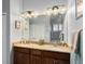 Bathroom with a double vanity, granite countertops, and a large mirror at 3160 Bailey Ann Dr, Ormond Beach, FL 32174
