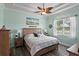 Comfortable bedroom featuring a ceiling fan and serene decor at 3160 Bailey Ann Dr, Ormond Beach, FL 32174
