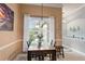 Cozy dining area with a table set for a meal and natural light at 3160 Bailey Ann Dr, Ormond Beach, FL 32174