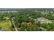 This aerial shot shows the property's location within a lush, tree-filled neighborhood. Ideal for serene living at 7686 Sw 81St St, Ocala, FL 34476