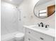 Updated bathroom with white marble walk-in shower, vanity, and modern fixtures at 7686 Sw 81St St, Ocala, FL 34476