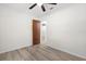 Neutral bedroom features gray flooring and a ceiling fan at 7686 Sw 81St St, Ocala, FL 34476