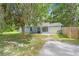 Charming single-story home with a well-kept lawn, attached garage, and inviting entrance at 7686 Sw 81St St, Ocala, FL 34476