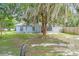 Inviting one-story home with an attached garage and a nicely maintained front lawn at 7686 Sw 81St St, Ocala, FL 34476