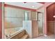 Bathroom featuring tub with tile surround and glass shower at 902 Heron Point Cir, Deland, FL 32724