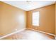 Bright bedroom featuring hardwood floors and a large window at 902 Heron Point Cir, Deland, FL 32724