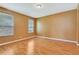 Bright bedroom with hardwood floors, with natural light from the windows at 902 Heron Point Cir, Deland, FL 32724