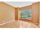 Bedroom featuring hardwood floors and large window with tree view at 902 Heron Point Cir, Deland, FL 32724