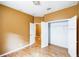 Clean bedroom featuring hardwood floors, neutral wall color, closet, and ceiling fan at 902 Heron Point Cir, Deland, FL 32724