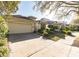 Well-kept single story house showcasing a spacious driveway and beautifully landscaped front yard at 902 Heron Point Cir, Deland, FL 32724
