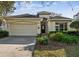 Charming single-story home featuring an attached two-car garage and well-maintained front yard at 902 Heron Point Cir, Deland, FL 32724