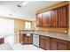 Well-equipped kitchen with granite countertops, stainless steel dishwasher, and lots of storage at 902 Heron Point Cir, Deland, FL 32724