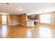 Spacious living room boasting hardwood floors, ample space, and seamless flow into the kitchen area at 902 Heron Point Cir, Deland, FL 32724