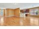 Open-concept living area featuring wood floors and a kitchen with a breakfast bar at 902 Heron Point Cir, Deland, FL 32724