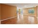 Expansive living room with hardwood floors, lots of light, and access to the outdoor patio at 902 Heron Point Cir, Deland, FL 32724