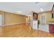 Open living area connected to the kitchen, featuring light wood floors throughout at 902 Heron Point Cir, Deland, FL 32724