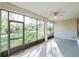 An enclosed patio offers views of the green lawn and natural light at 902 Heron Point Cir, Deland, FL 32724
