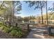 Picturesque view of the pond, path, and trees, surrounded by nature's beauty at 902 Heron Point Cir, Deland, FL 32724